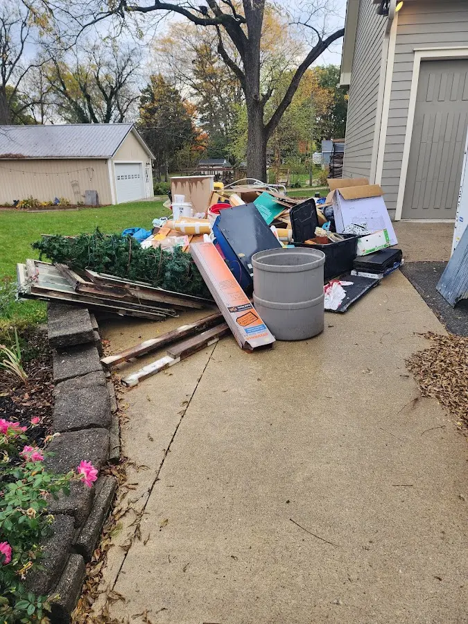 Dumpster being loaded with debris for Demolition Dumpster Rental in Fayette